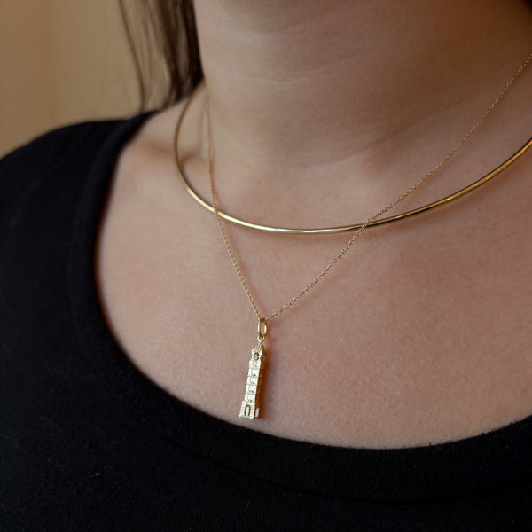 Purdue Bell Tower Pendant shown on figure in gold on Cable Chain with Neck Collar