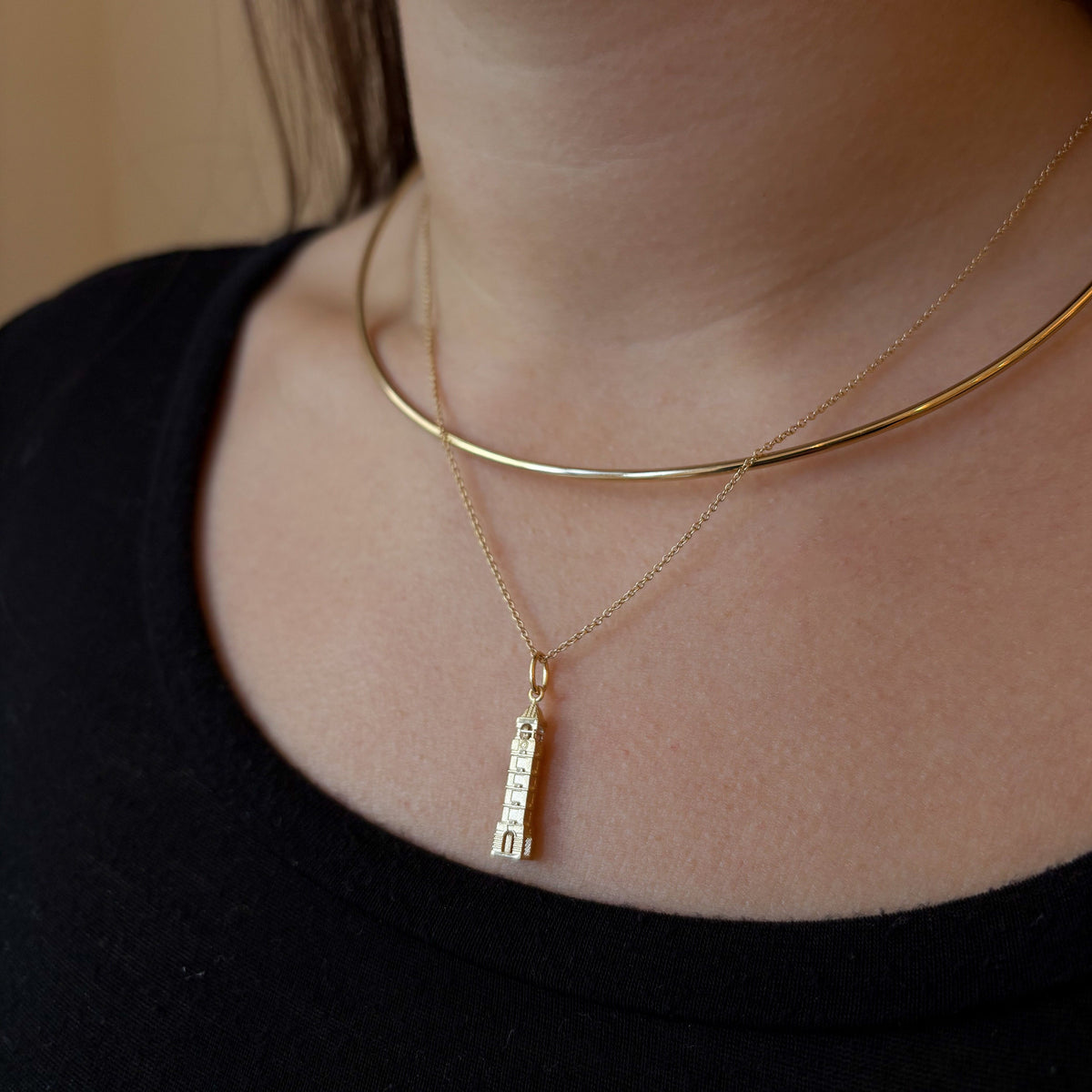 Purdue Bell Tower Pendant shown on figure in gold on Cable Chain with Neck Collar