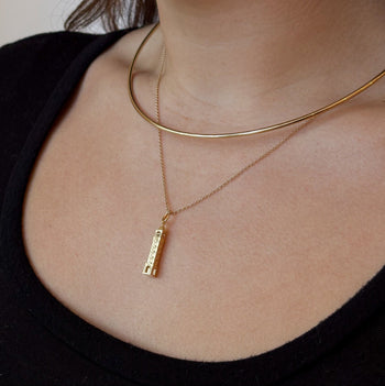 Purdue Bell Tower Pendant shown on figure in gold on Cable Chain with Neck Collar