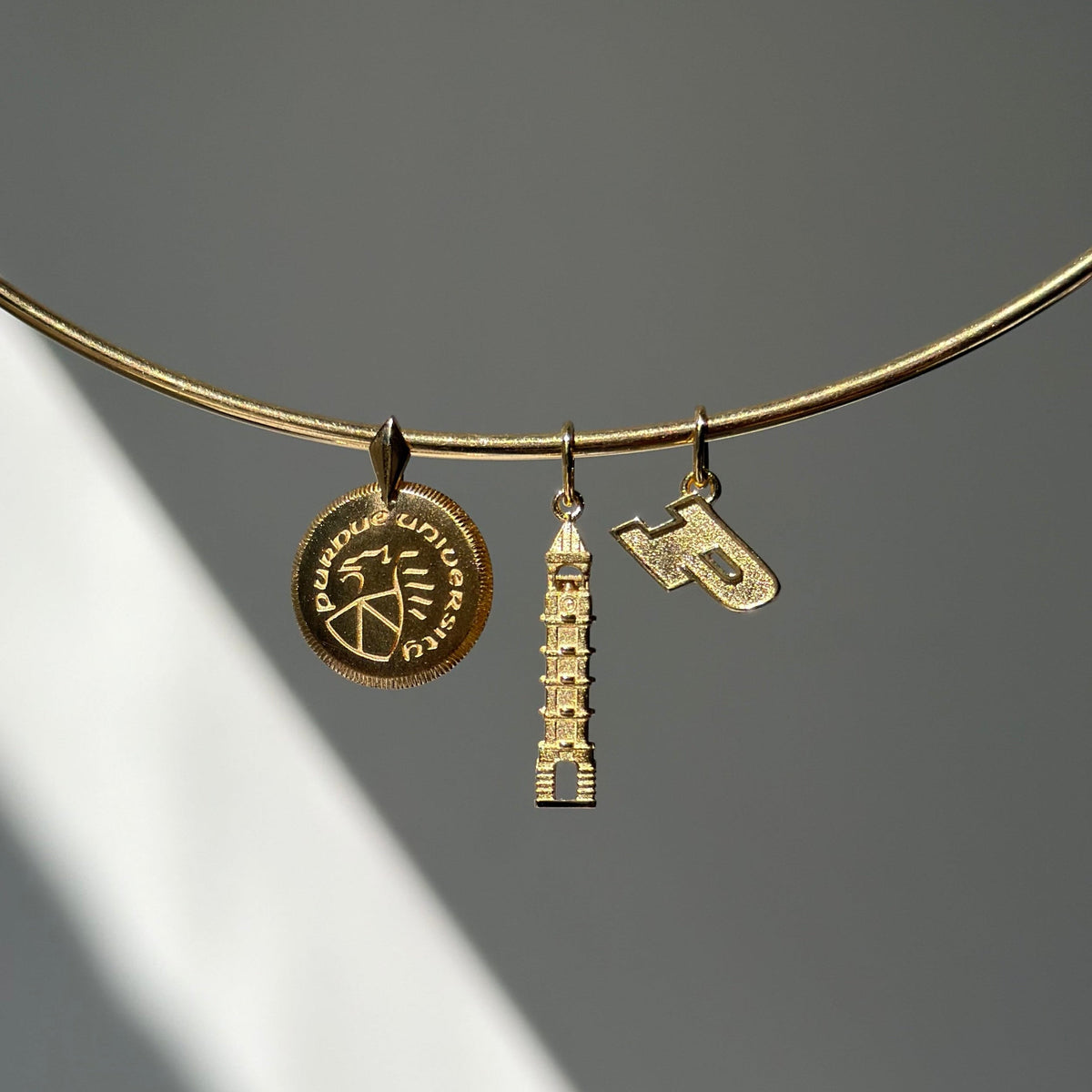 Purdue Florentine Petite Pendant on Neck Collar in gold with Purdue Bell Tower in gold and Purdue Logo Charm in gold