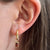 Mini U Hoop Gemstone Bundle shown on figure in gold with Garnet Gemstone Charm