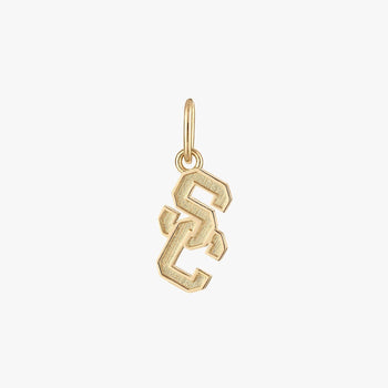 A gold charm in the shape of the USC logo.