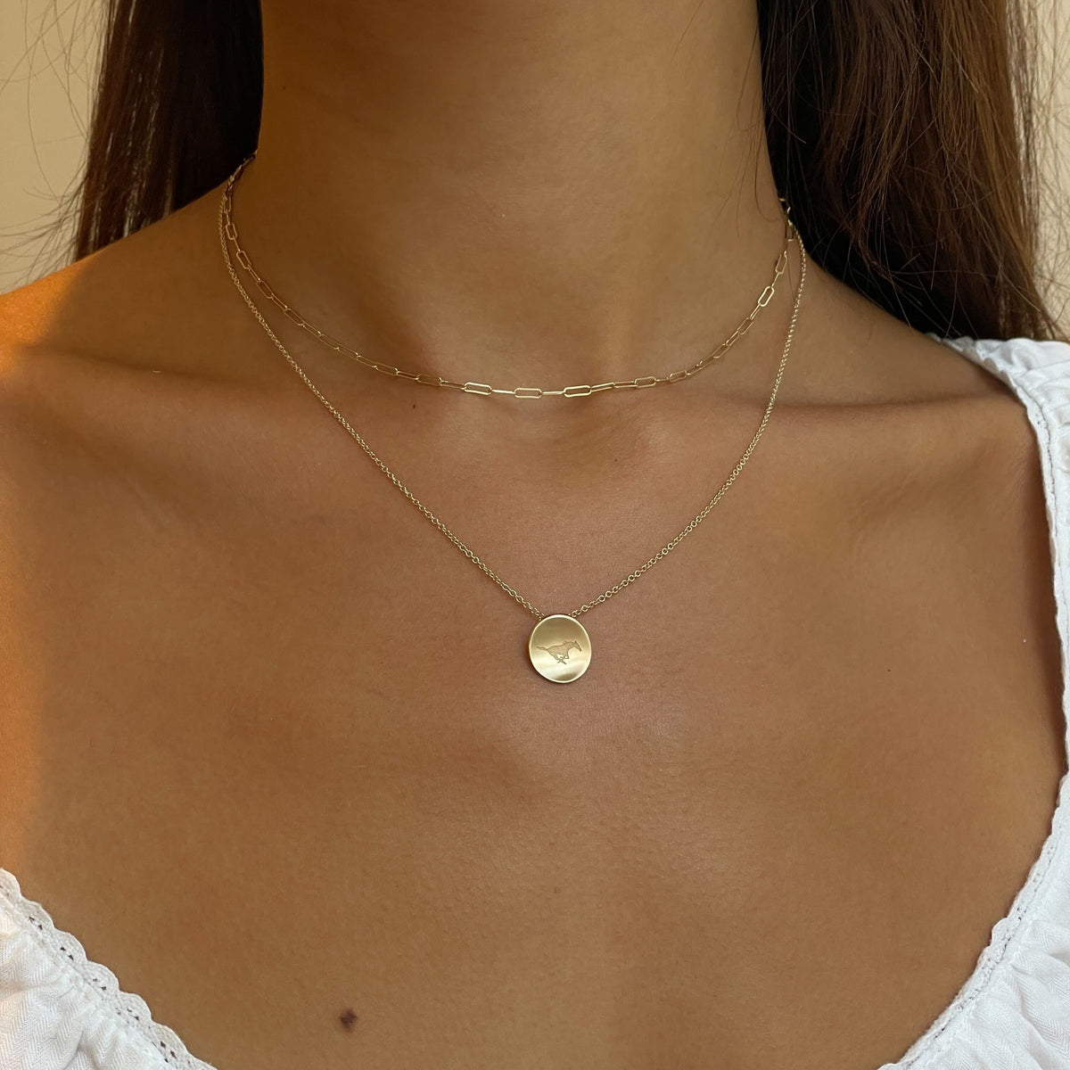 SMU Peruna Necklace shown on figure in gold with Link Chain Choker