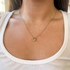 Shamrock Charm shown on figure in gold on Cable Chain