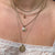 Pearl Charm shown on figure on Sunburst Pendant with Starfish Charm on Neck Collar