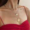Texas A&M Crest Sunburst Bundle shown on figure in gold with Texas A&M Crest Florentine Pendant on Cable Chain and Neck Collar