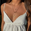 Tennessee Charm Bundle shown on figure in gold with Tennessee Sunburst Pendant on long Cable Chain in gold