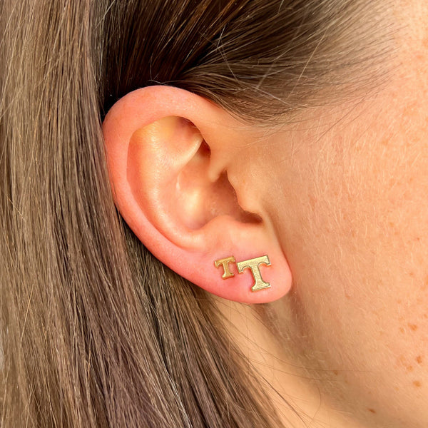 Tennessee T Stud Earring shown on figure in gold in size 5mm and size 8mm