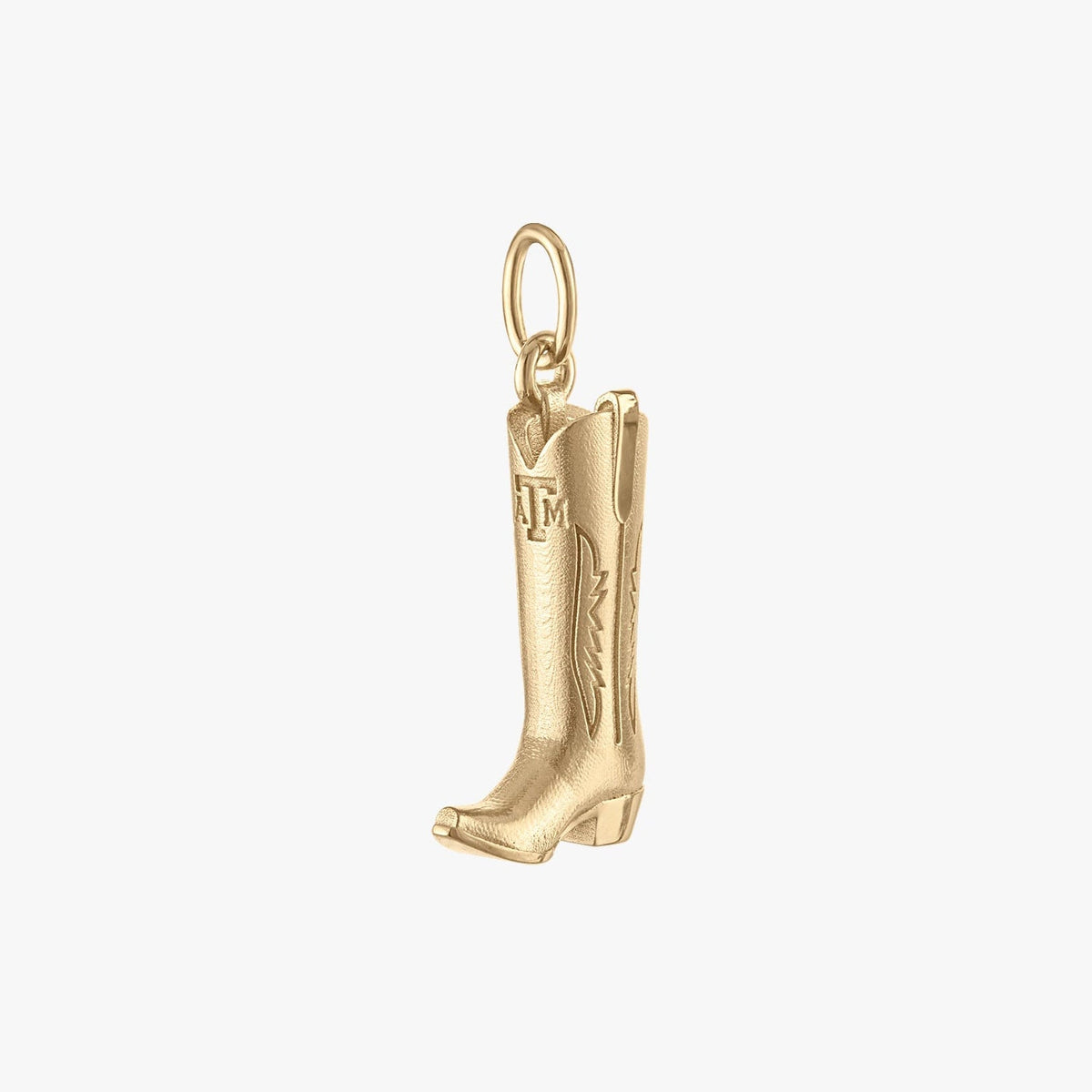Gold cowboy boot charm on a white background