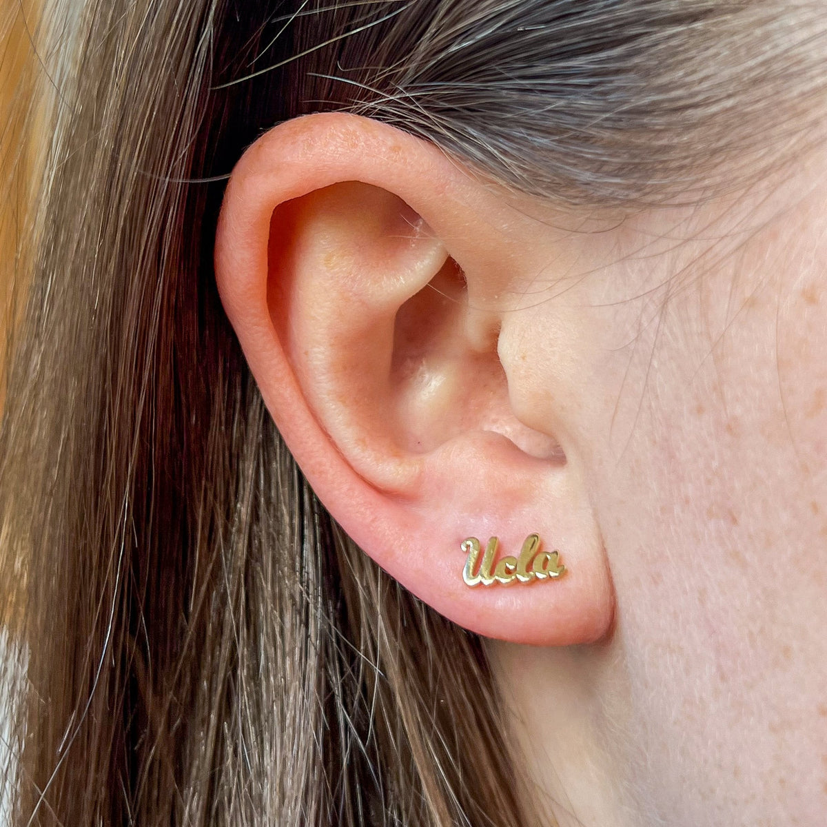 UCLA Logo Stud Earring shown on figure in gold