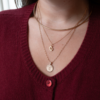UGA Logo Charm shown on figure in gold on Cable Chain, with Neck Collar, and UGA Sunburst Pendant on Link Chain