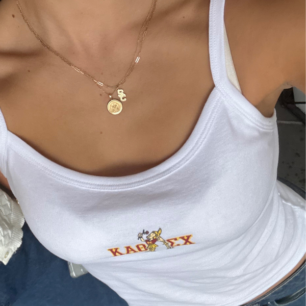 USC Logo Charm shown on figure in gold on Link Chain with USC Sunburst Pendant on Cable Chain in gold