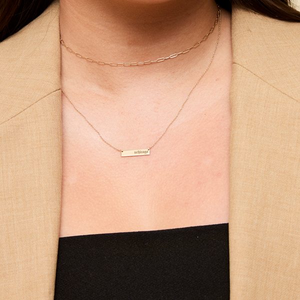 UChicago Horizontal Bar Necklace shown on figure in gold