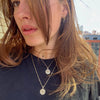 UCONN Sunburst Pendant shown on figure in gold on 22" Link Chain