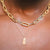 Alabama Denny Chimes Necklace shown on figure in gold with Large Link Chain Choker