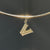 Villanova Logo Charm shown on Neck Collar in gold