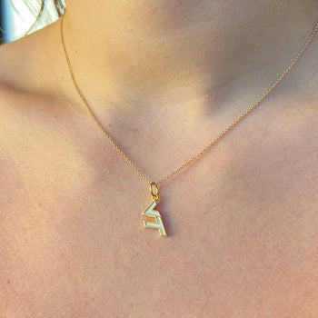 Virginia Tech VT Charm shown on figure in gold on Cable Chain