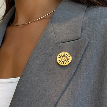Wisconsin Union Lapel Pin shown on figure in gold