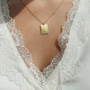 Arizona Vintage Rectangle Pendant shown on figure in gold on Cable Chain