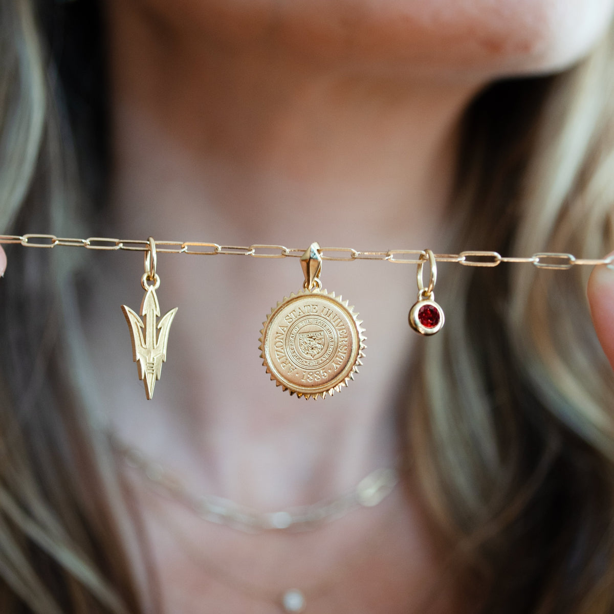 Arizona State Pitchfork Charm shown with Arizona State Sunburst Pendant and Garnet Gemstone on Link Chain in gold