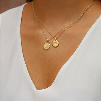 Gold Delta Phi Epsilon Sunburst Crest Necklace on Model