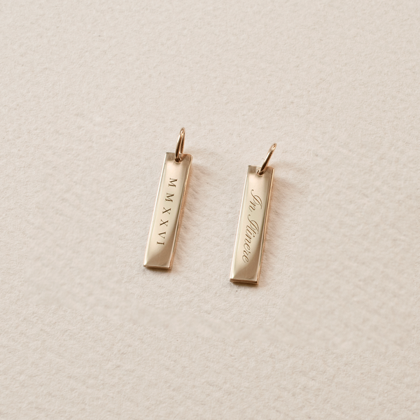 2026 Grad Layering Bar shown with In Itinere back engraving