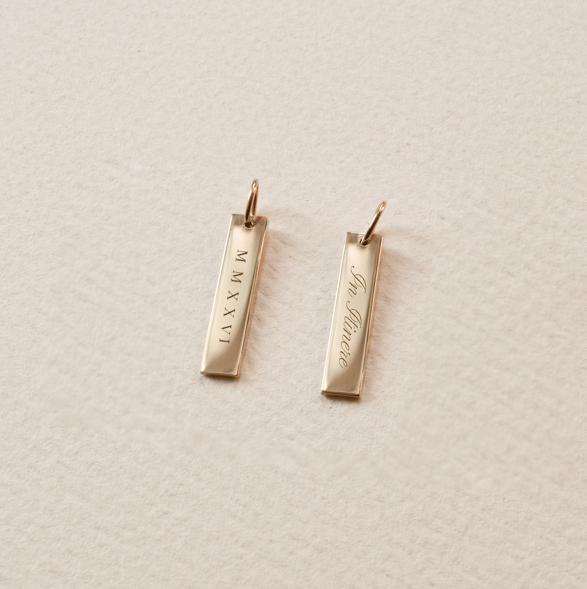 2026 Grad Layering Bar shown with In Itinere back engraving