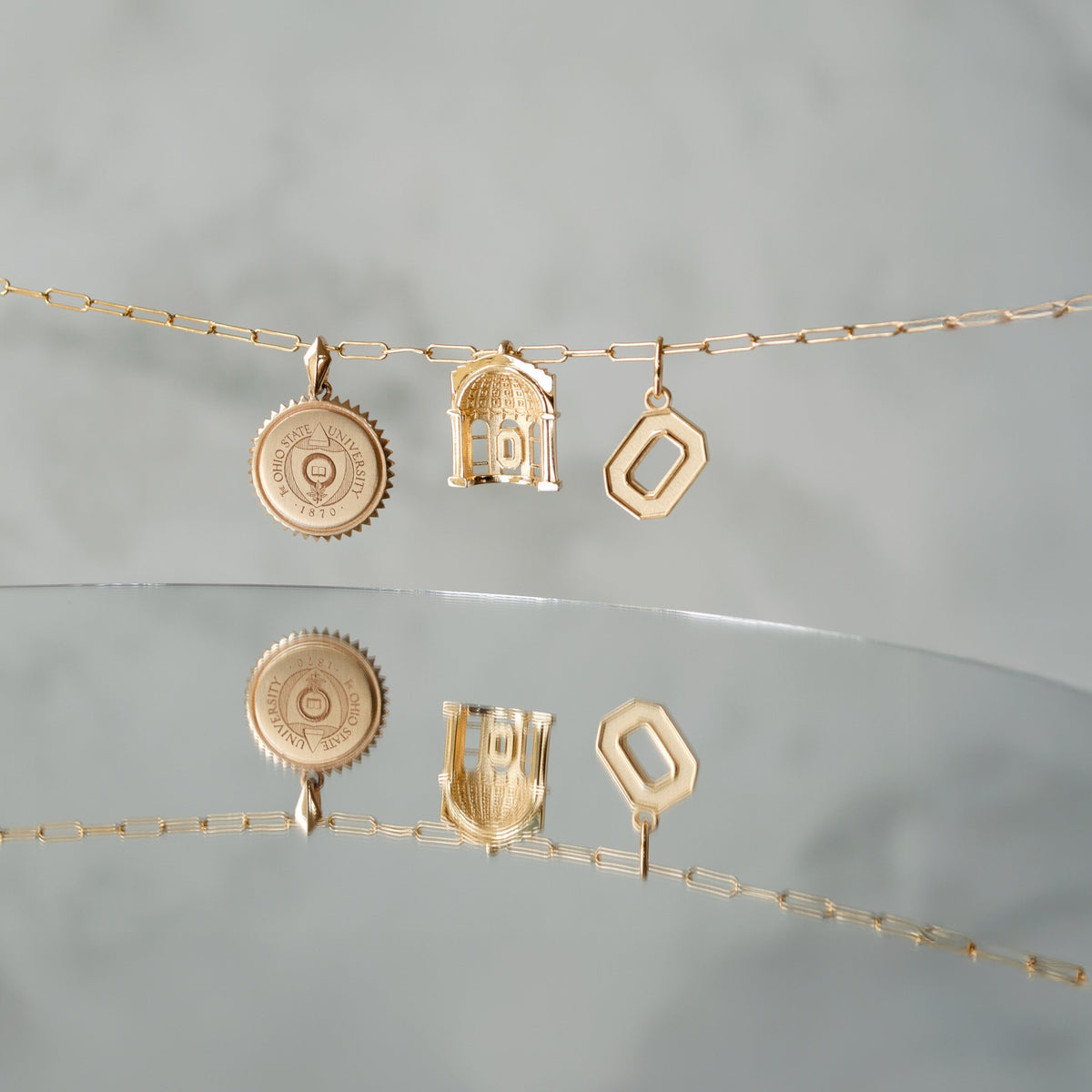 Ohio State Seal Sunburst shown on Link Chain with Rotunda Pendant and O Letter Charm in gold