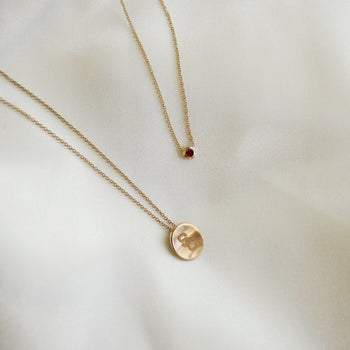 USC SC Petite Necklace and Garnet Gemstone Necklace laydown shown in gold