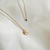 Rice R Organic Necklace Petite shown in gold with Sapphire Gemstone Necklace