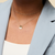 Tri Sigma Sailboat Necklace shown on figure in gold