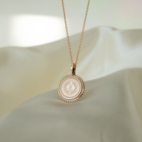 Duke University Sunburst Pendant shown on Cable Chain in gold